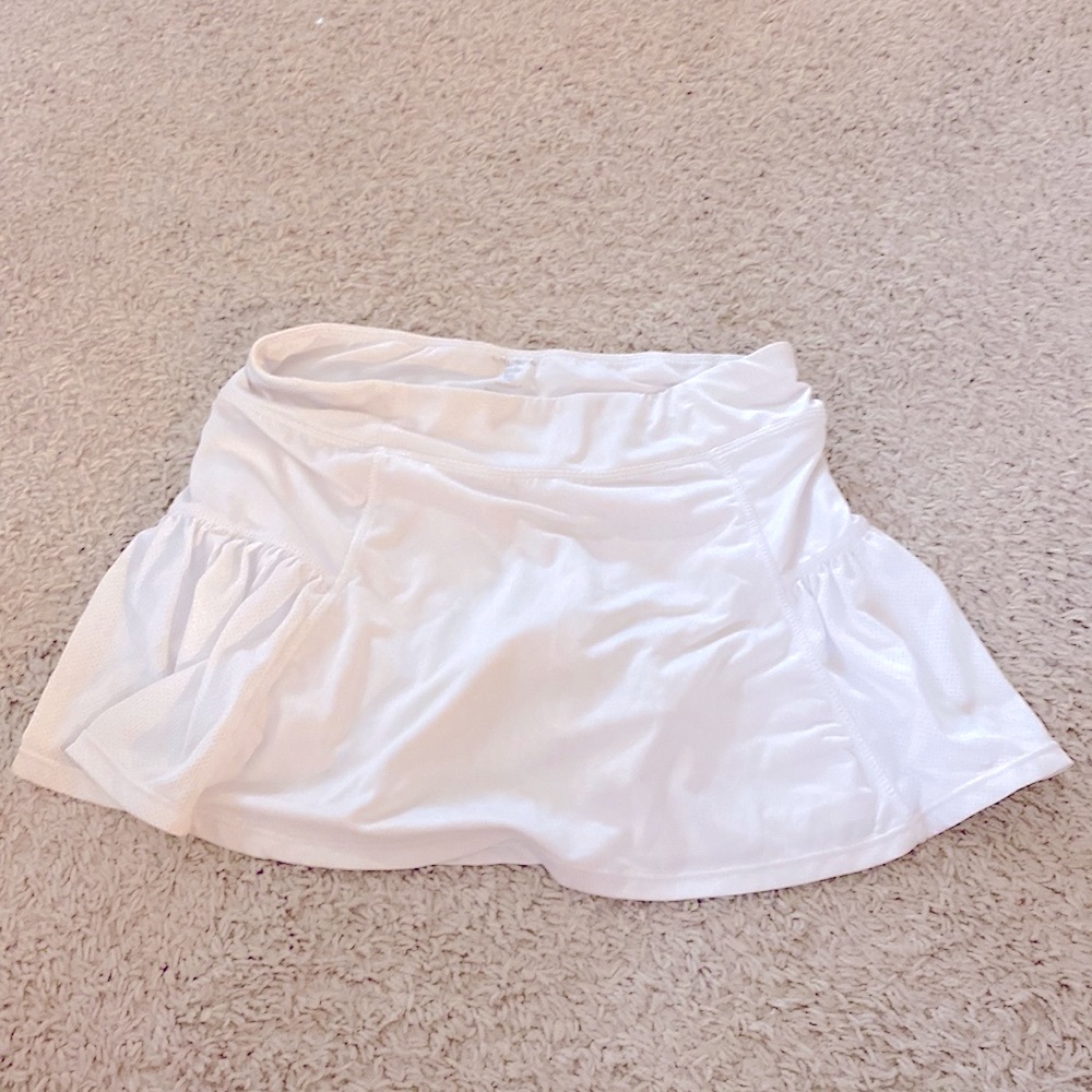 Hey I am selling a white skirt and It is 80% polyester and has built in spandex!
